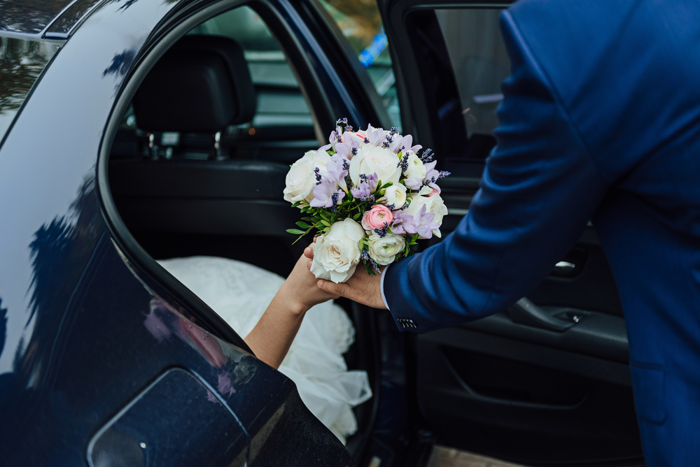 The,Groom,Helps,The,Bride,To,Leave,The,Car